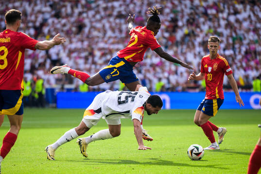 Nicholas Williams of Spain and Emre Can of Germany