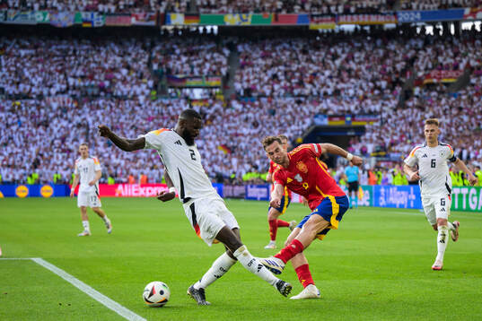 Antonio Ruediger of Germany and Fabian Ruiz Pena of Spain