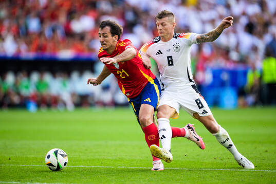 Mikel Oyarzabal of Spain and Toni Kroos of Germany