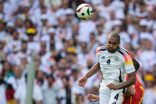 Jonathan Tah of Germany and Alvaro Morata of Spain
