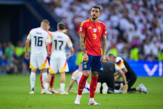 Joselu of Spain looks dejected