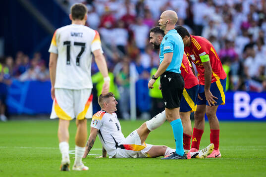 Toni Kroos of Germany and Daniel Carvajal of Spain