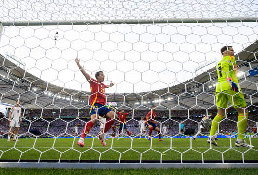 Mikel Oyarzabal of Spain celebrates and Manuel Neuer of