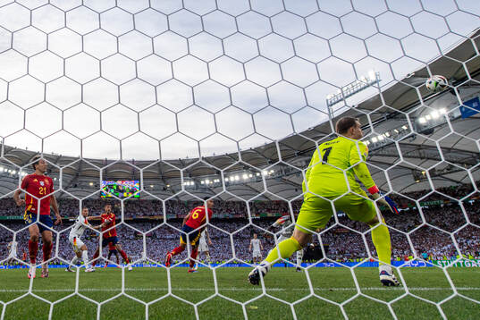 Mikel Merino of Spain scores 2-1 behind goalkeeper Manuel