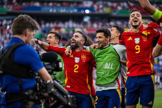 Daniel Carvajal and Joselu of Spain celebrate