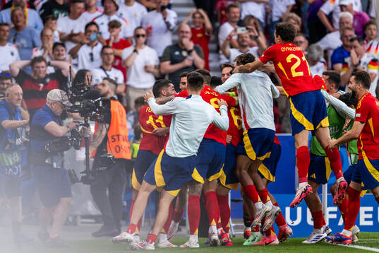 Mikel Merino of Spain celebrates with team mates