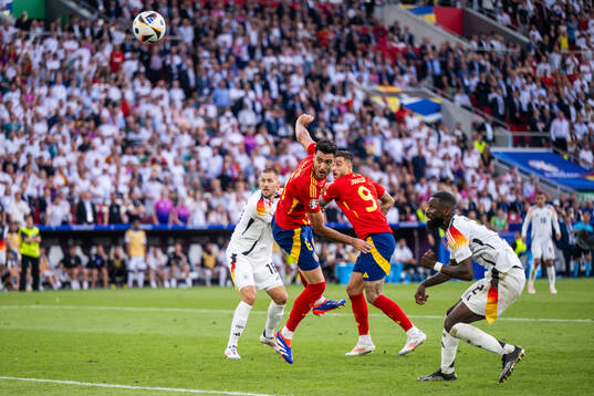 Antonio Rüdiger of Germany sees Mikel Merino of Spain