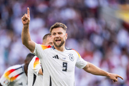 Niclas Füllkrug of Germany reacts