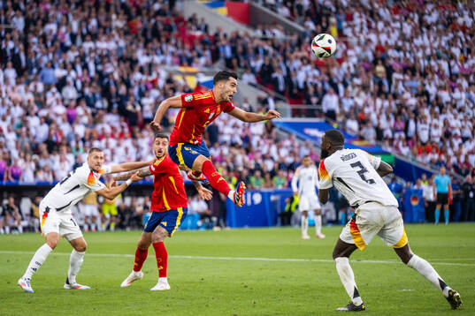 Antonio Rüdiger of Germany sees Mikel Merino of Spain