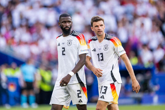 Antonio Rüdiger and Thomas Müller of Germany