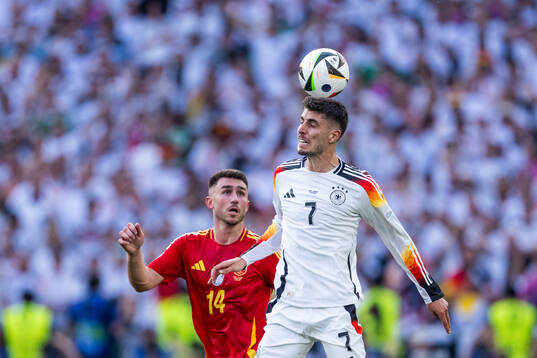 Aymeric Laporte of Spain and Kai Havertz of Germany