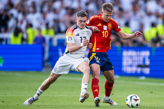 Florian Wirtz of Germany and Daniel Olmo of Spain