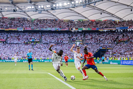 Antonio Rüdiger and Joshua Kimmich of Germany compete for