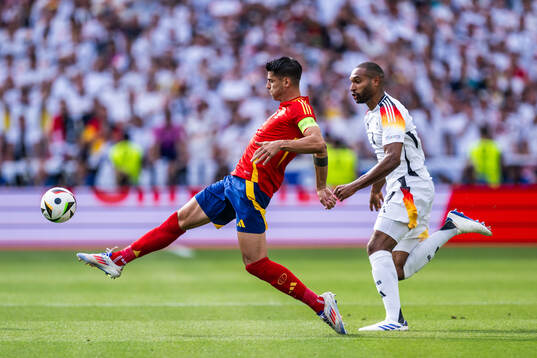 Alvaro Morata of Spain and Jonathan Tah of Germany