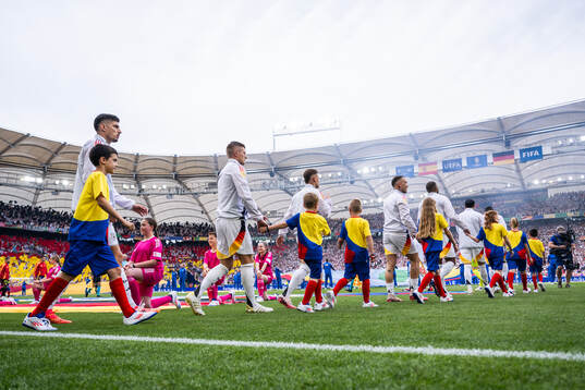 Kai Havertz and Toni Kroos of Germany enter the pitch
