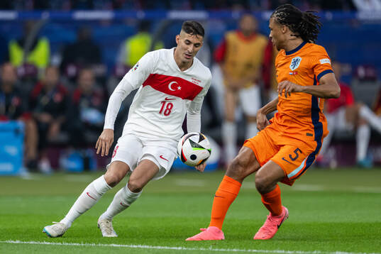 Mert Muldur of Turkey and Nathan Aké of Netherlands