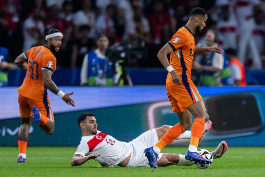 Kaan Ayhan of Turkey and Cody Gakpo of Netherlands