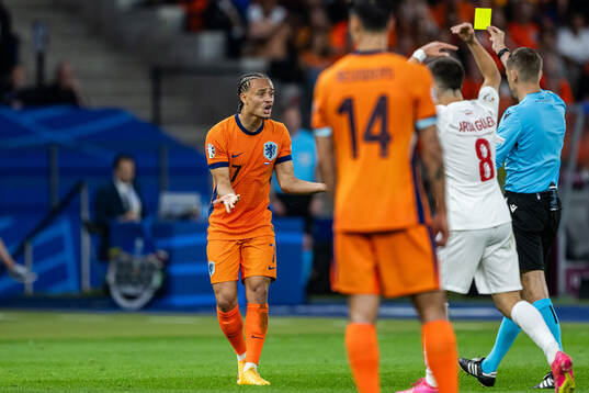 Xavi Simons of Netherlands reacts when receiving a warning