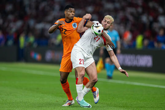 Denzel Dumfries of Netherlands and Baris Alper Yilmaz of