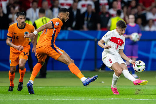 Cody Gakpo of Netherlands and Arda Guler of Turkey