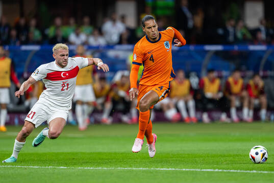 Baris Alper Yilmaz of Turkey and Virgil van Dijk of