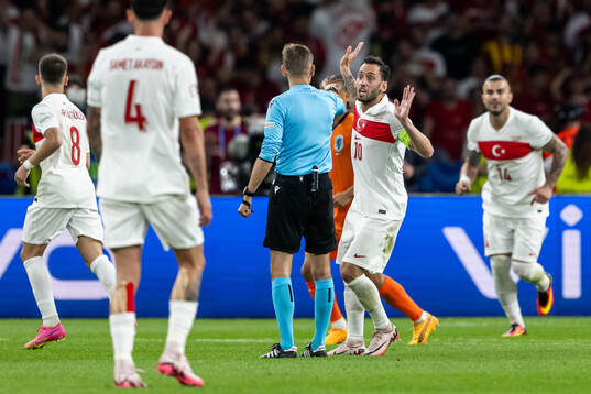 Hakan Calhanoglu of Turkey reacts