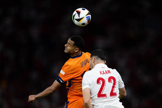 Cody Gakpo of Netherlands and Kaan Ayhan of Turkey