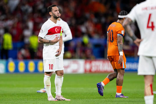 Hakan Calhanoglu of Turkey looks dejected