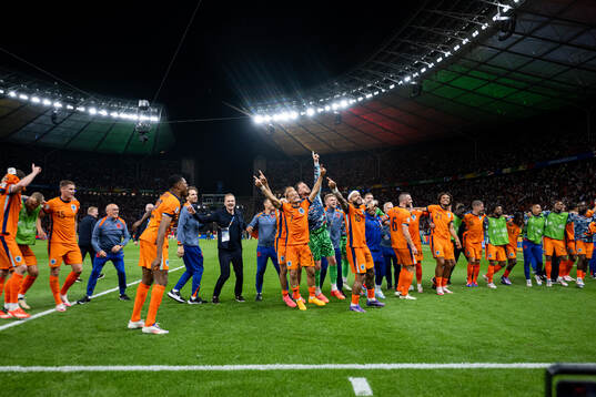Xavi Simons and Memphis Depay of Netherlands celebrate