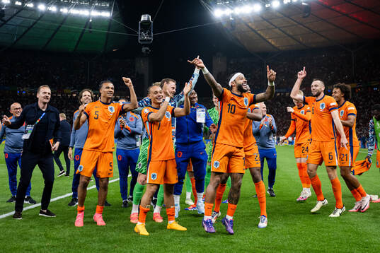 Xavi Simons and Memphis Depay of Netherlands  celebrate