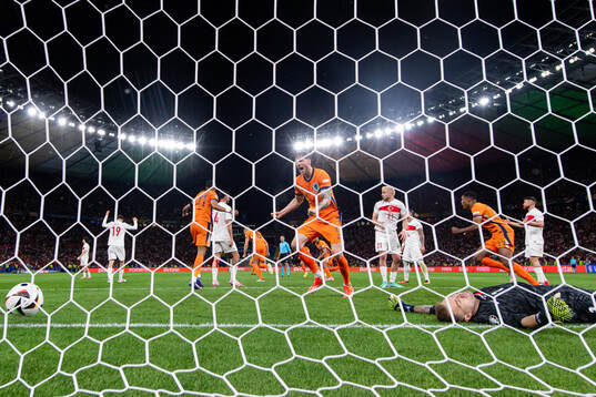 Wout Weghorst of Netherlands celebrates and goalkeeper Mert