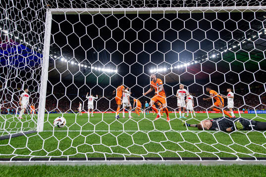 Wout Weghorst of Netherlands celebrates and goalkeeper Mert