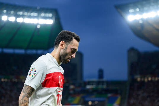 Hakan Calhanoglu of Turkey looks dejected