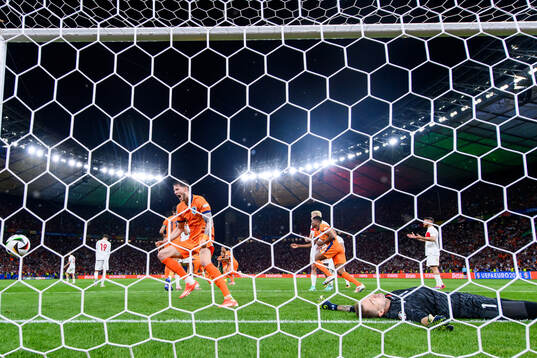 Wout Weghorst of Netherlands celebrates as goalkeeper Mert