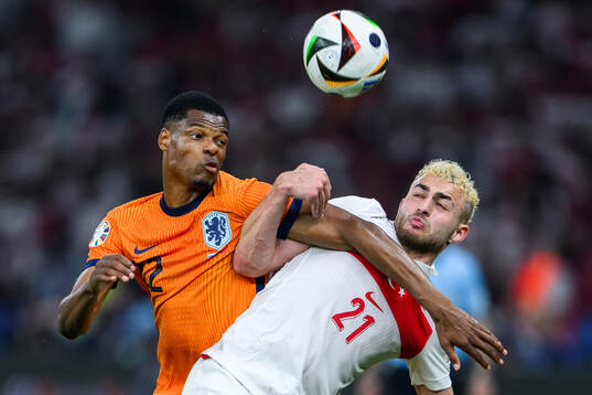 Denzel Dumfries of Netherlands and Baris Alper Yilmaz of