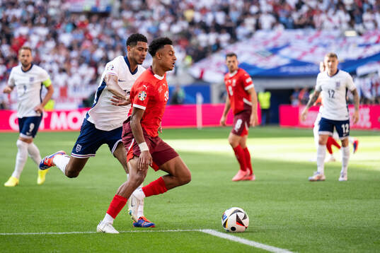Jude Bellingham of England and Dan Ndoye of Switzerland