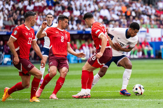 Fabian Rieder of Switzerland and Jude Bellingham of England