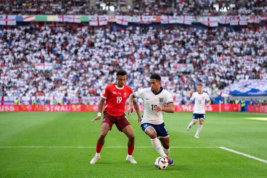 Dan Ndoye of Switzerland and Jude Bellingham of England