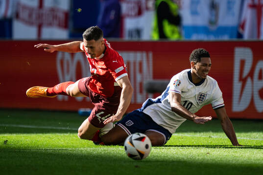 Fabian Schär of Switzerland and Jude Bellingham of England