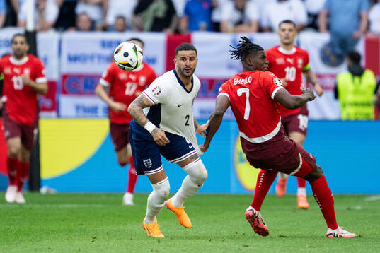 Kyle Walker of England and Breel Embolo of Switzerland