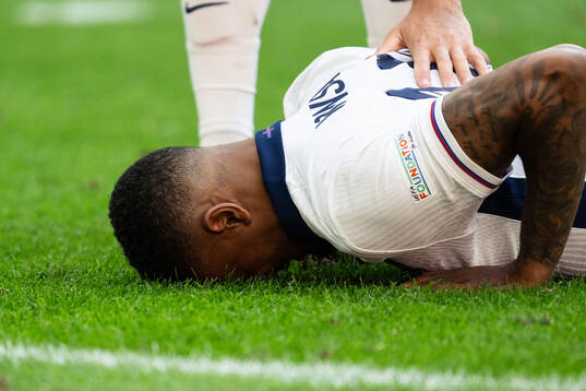 Ezri Konsa of England in pain
