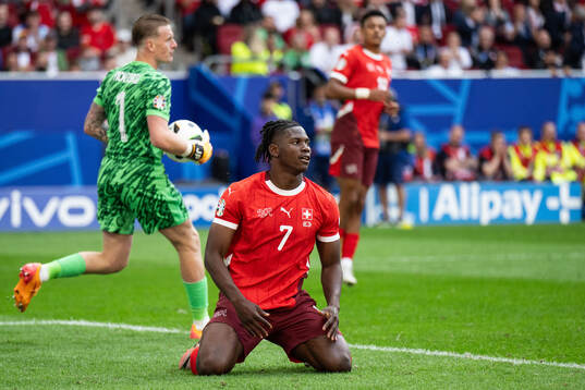Breel Embolo of Switzerland looks dejected