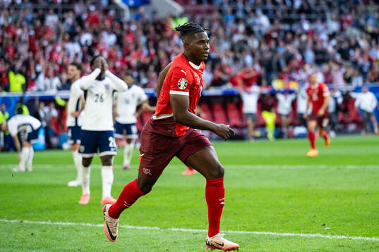 Breel Embolo of Switzerland celebrates