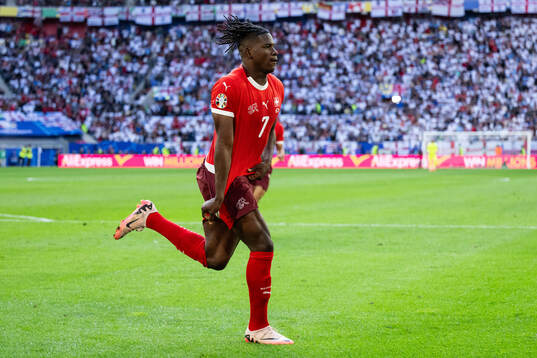 Breel Embolo of Switzerland celebrates