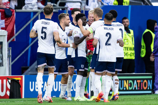 Bukayo Saka of England celebrates with team mates