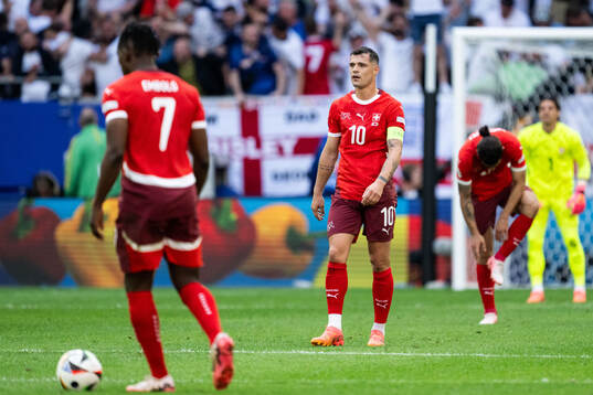 Granit Xhaka of Switzerland looks dejected