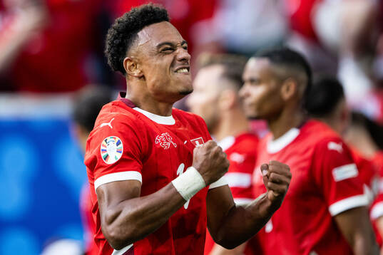 Dan Ndoye of Switzerland celebrates