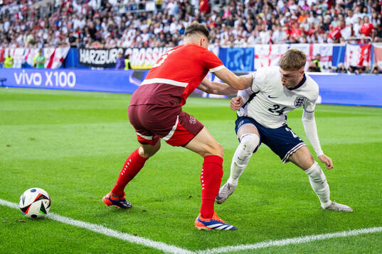 Silvan Widmer of Switzerland and Cole Palmer of England