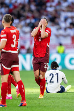 Fabian Schär of Switzerland reacts