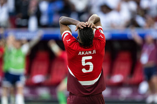 Manuel Akanji of Switzerland looks dejected